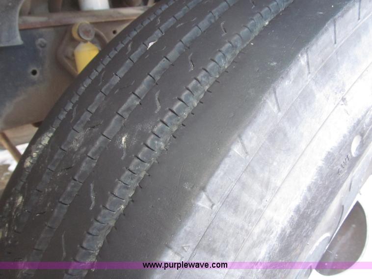 image for item F7252 1997 Ford L8501 Louisville 20' flatbed truck with lift gate