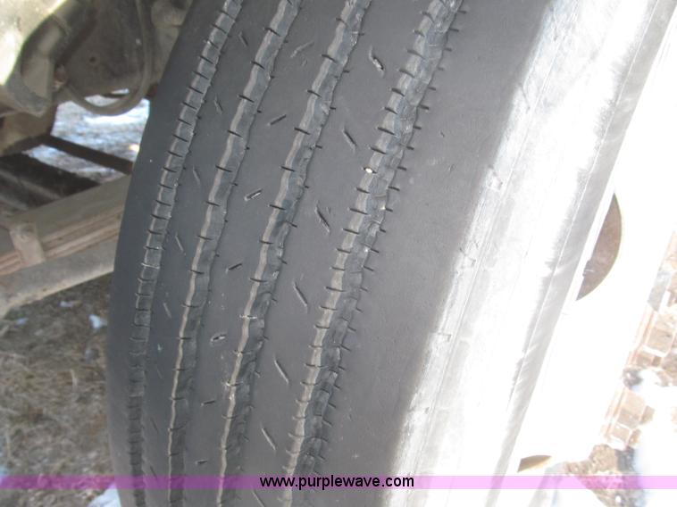 image for item F7252 1997 Ford L8501 Louisville 20' flatbed truck with lift gate