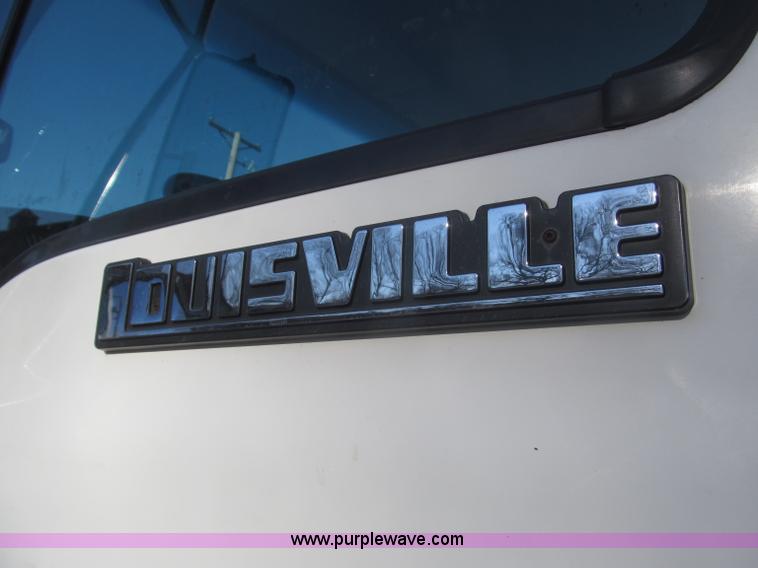 image for item F7252 1997 Ford L8501 Louisville 20' flatbed truck with lift gate