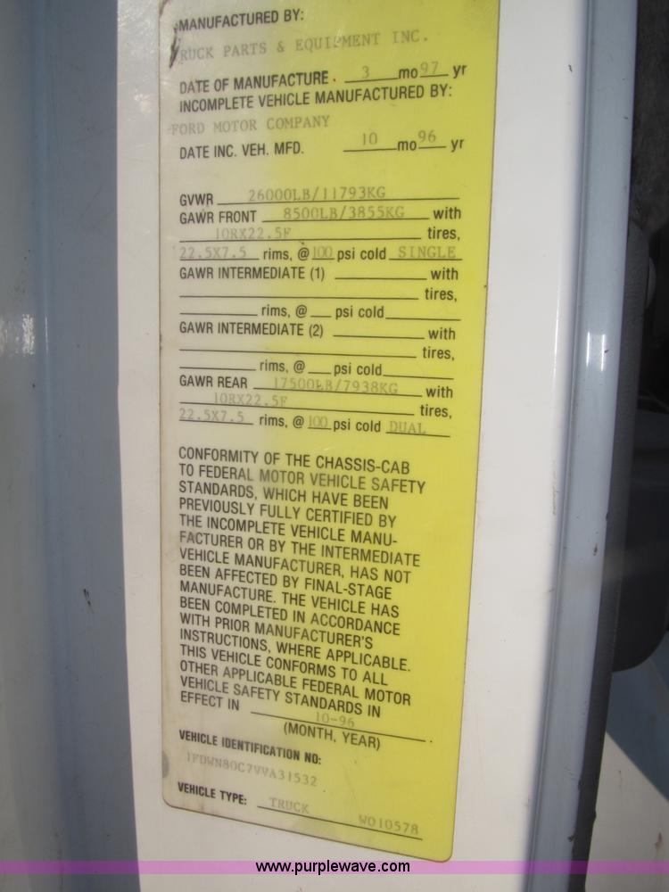 image for item F7252 1997 Ford L8501 Louisville 20' flatbed truck with lift gate