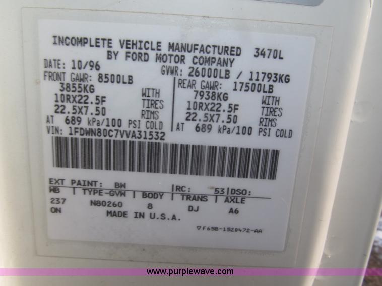 image for item F7252 1997 Ford L8501 Louisville 20' flatbed truck with lift gate