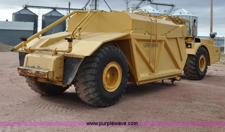 image for item G6420 John Deere 860 water wagon