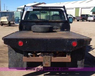 image for item C1853 1999 Ford F350 flatbed pickup truck