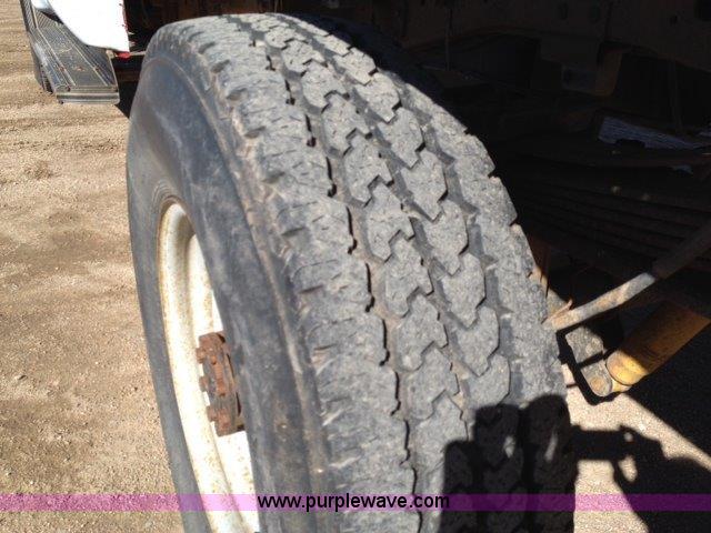 image for item C1853 1999 Ford F350 flatbed pickup truck