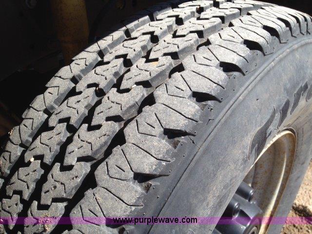 image for item C1853 1999 Ford F350 flatbed pickup truck