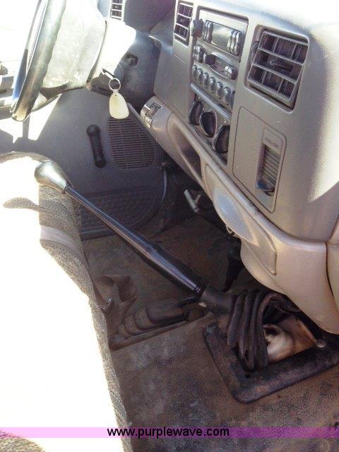 image for item C1853 1999 Ford F350 flatbed pickup truck