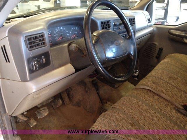 image for item C1853 1999 Ford F350 flatbed pickup truck