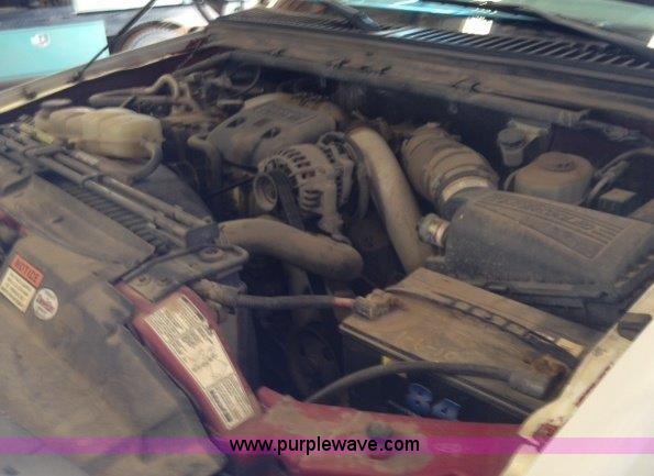 image for item C1853 1999 Ford F350 flatbed pickup truck