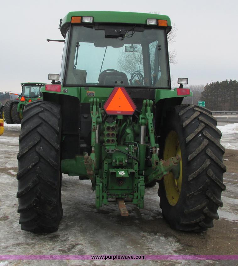 image for item G8824 1999 John Deere 7410 MFWD tractor