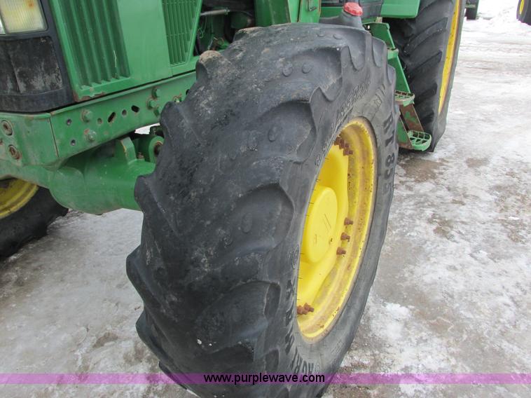image for item G8824 1999 John Deere 7410 MFWD tractor
