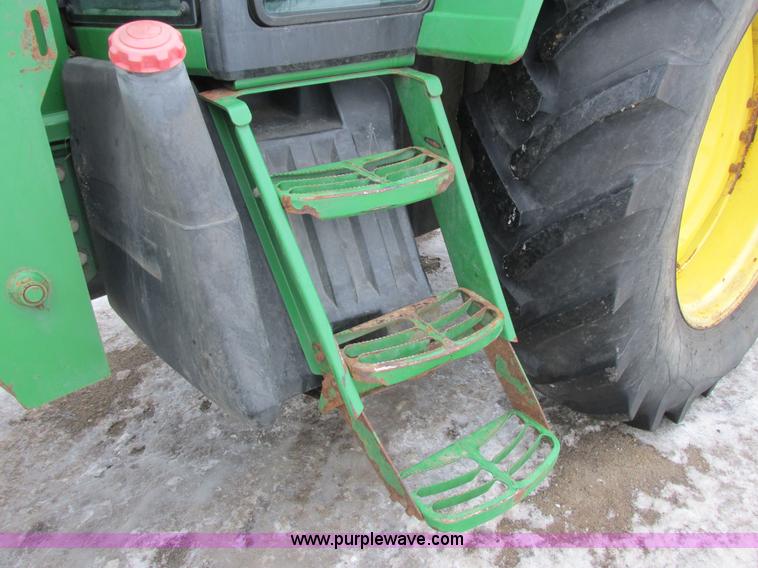 image for item G8824 1999 John Deere 7410 MFWD tractor