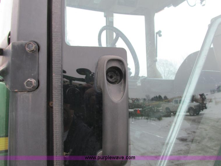 image for item G8824 1999 John Deere 7410 MFWD tractor