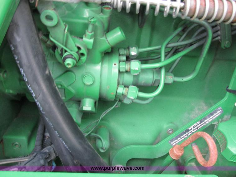 image for item G8824 1999 John Deere 7410 MFWD tractor