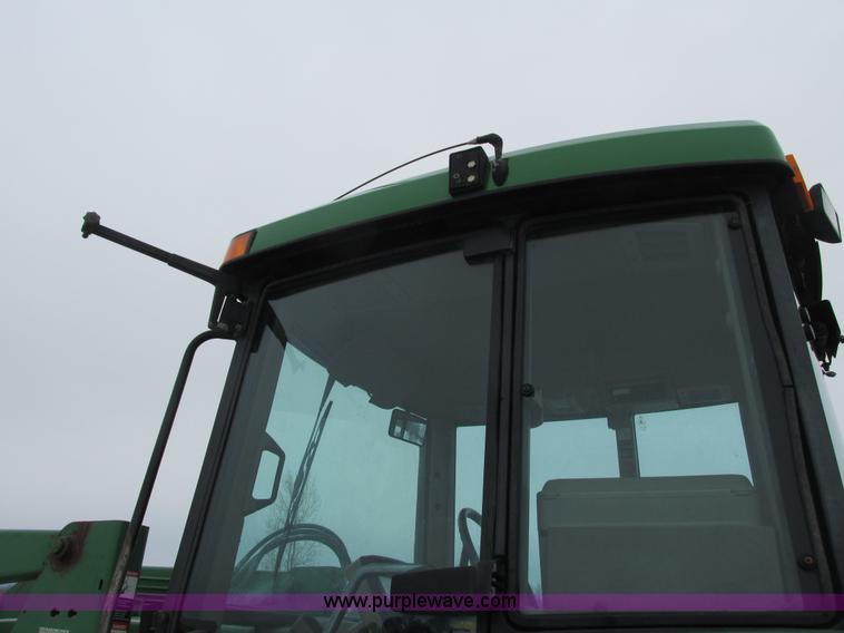 image for item G8824 1999 John Deere 7410 MFWD tractor