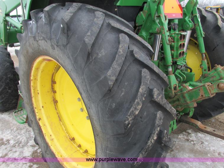 image for item G8824 1999 John Deere 7410 MFWD tractor