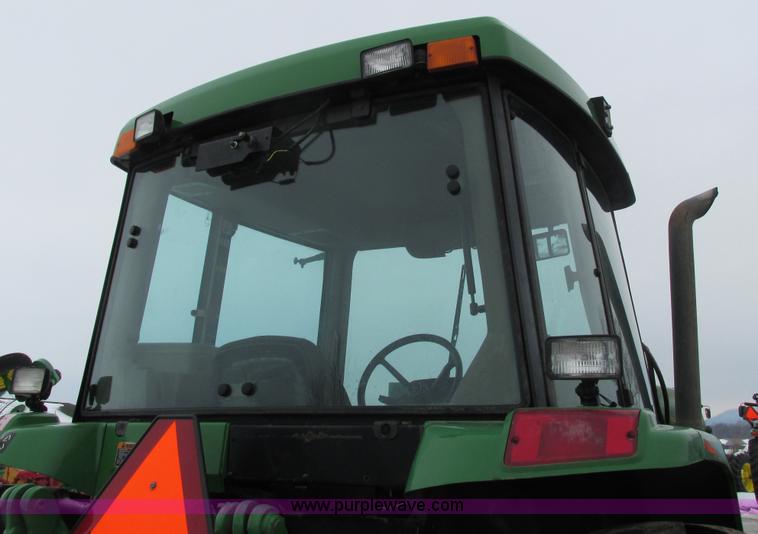 image for item G8824 1999 John Deere 7410 MFWD tractor