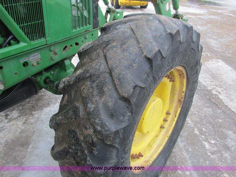 image for item G8824 1999 John Deere 7410 MFWD tractor