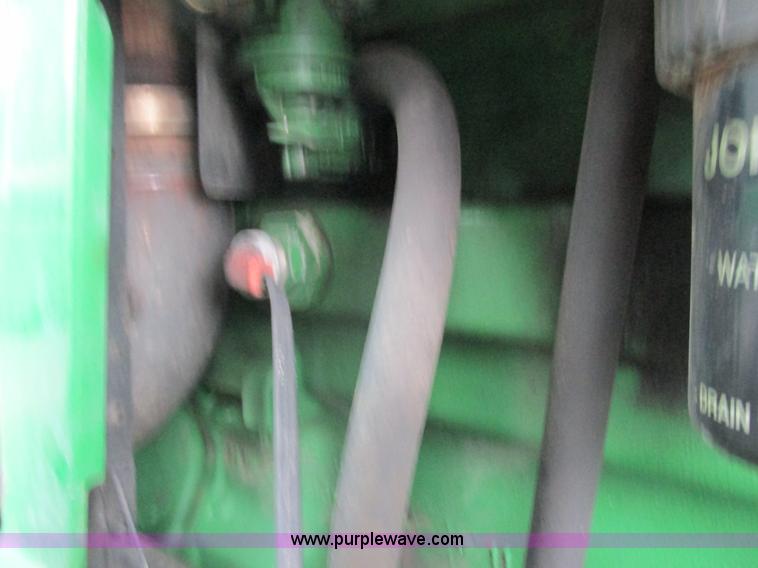 image for item G8824 1999 John Deere 7410 MFWD tractor