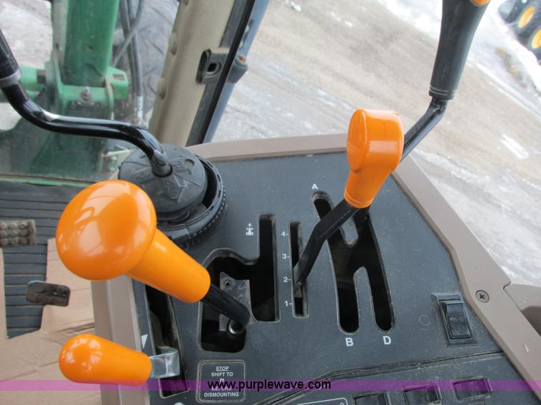 image for item G8824 1999 John Deere 7410 MFWD tractor