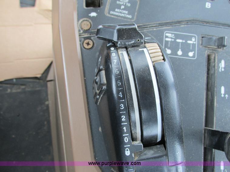 image for item G8824 1999 John Deere 7410 MFWD tractor