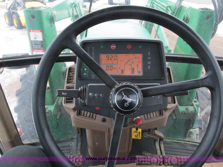 image for item G8824 1999 John Deere 7410 MFWD tractor