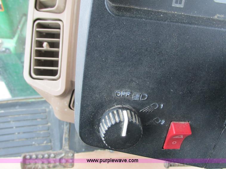 image for item G8824 1999 John Deere 7410 MFWD tractor