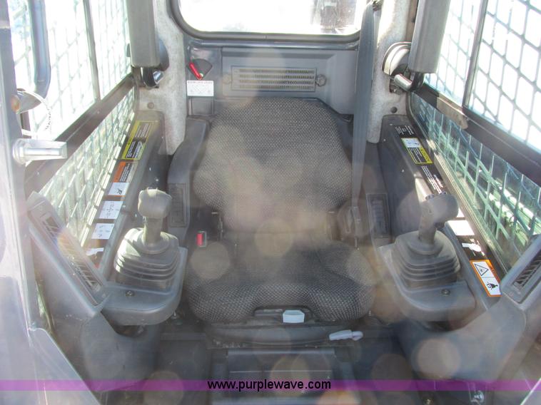 image for item G8831 2012 John Deere 318D skid steer