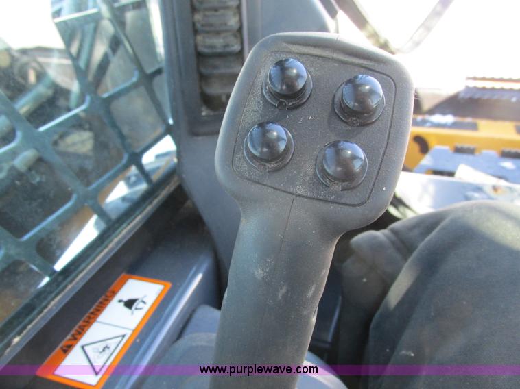 image for item G8831 2012 John Deere 318D skid steer