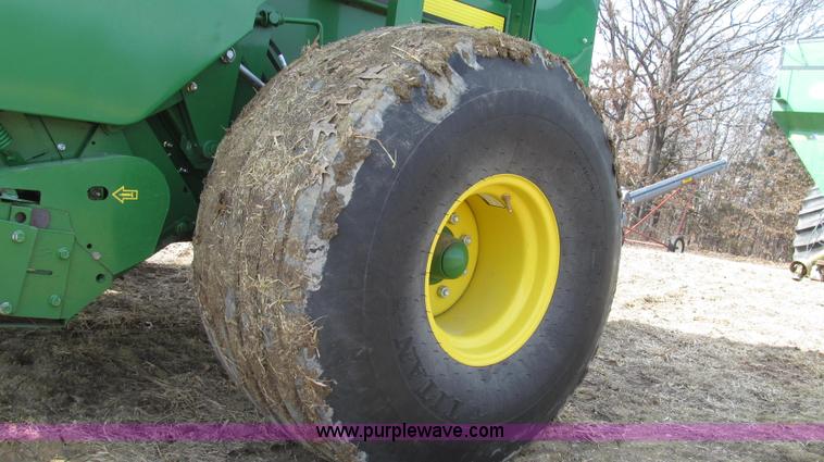 image for item G2296 2013 John Deere 569 round baler