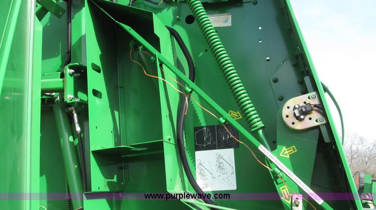 image for item G2296 2013 John Deere 569 round baler