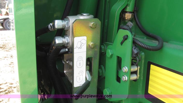 image for item G2296 2013 John Deere 569 round baler