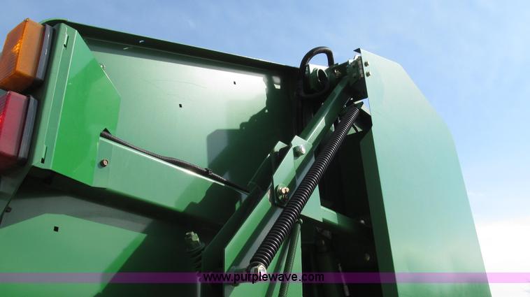 image for item G2296 2013 John Deere 569 round baler