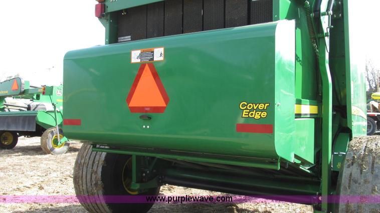 image for item G2296 2013 John Deere 569 round baler