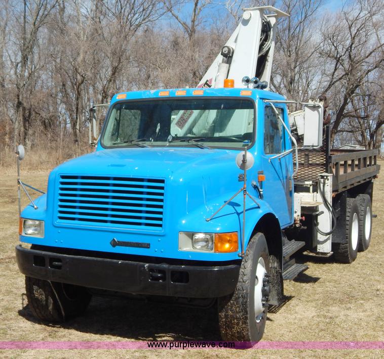 image for item I1134 1996 International 4900 flatbed truck with crane