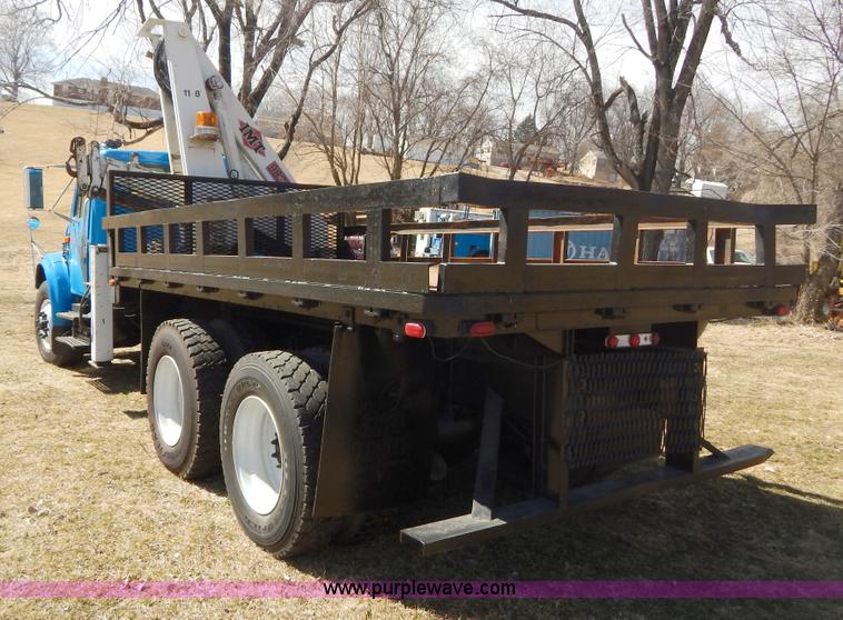 image for item I1134 1996 International 4900 flatbed truck with crane