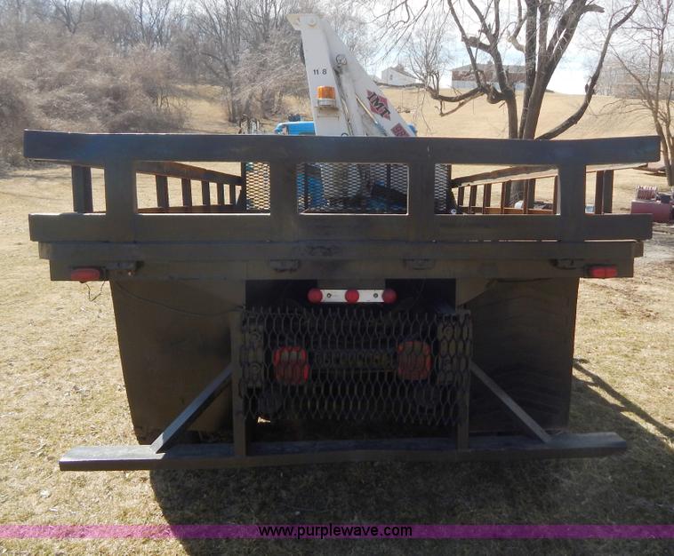 image for item I1134 1996 International 4900 flatbed truck with crane