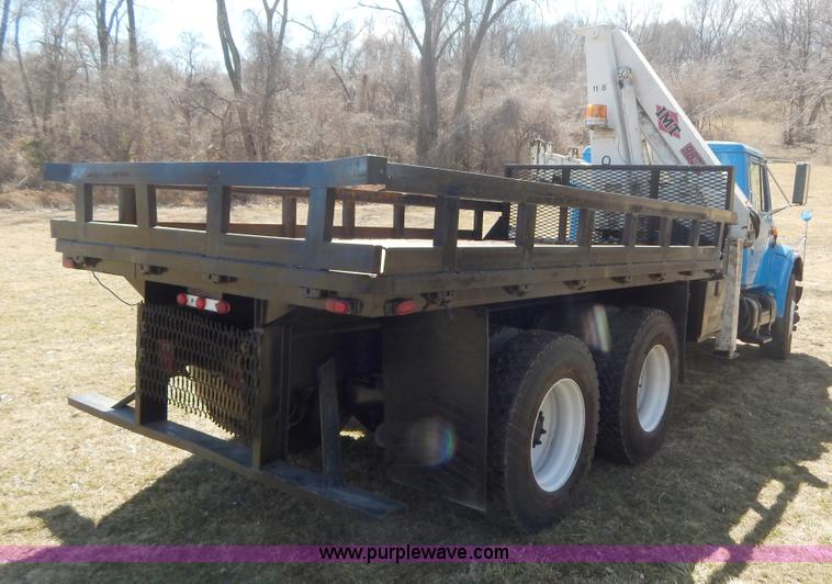 image for item I1134 1996 International 4900 flatbed truck with crane