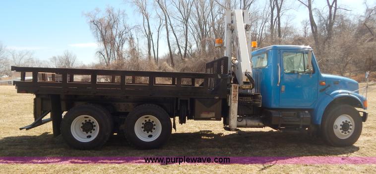 image for item I1134 1996 International 4900 flatbed truck with crane