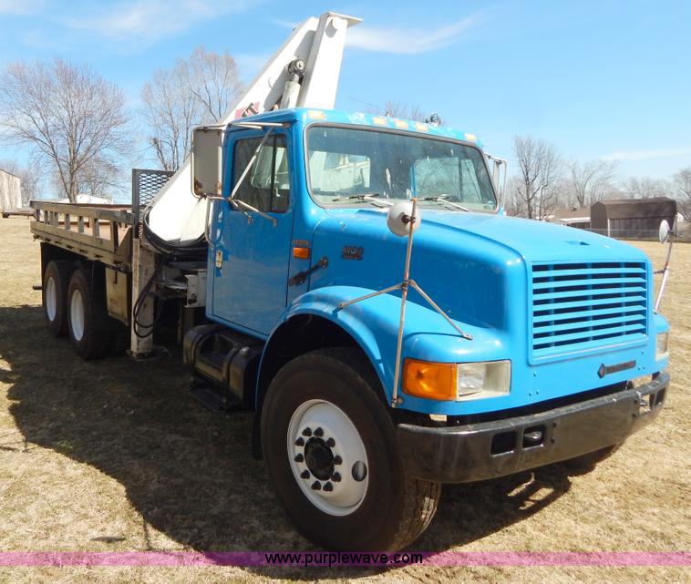 image for item I1134 1996 International 4900 flatbed truck with crane