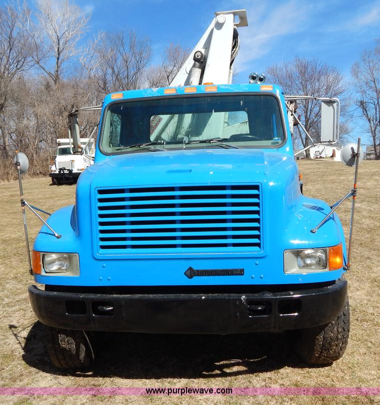 image for item I1134 1996 International 4900 flatbed truck with crane