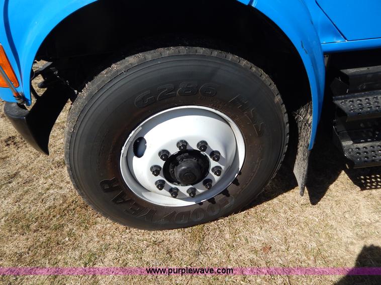 image for item I1134 1996 International 4900 flatbed truck with crane