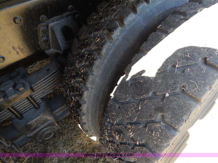 image for item I1134 1996 International 4900 flatbed truck with crane