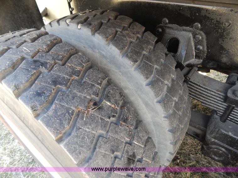 image for item I1134 1996 International 4900 flatbed truck with crane