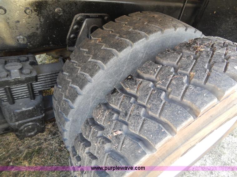 image for item I1134 1996 International 4900 flatbed truck with crane