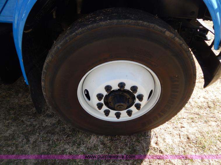 image for item I1134 1996 International 4900 flatbed truck with crane