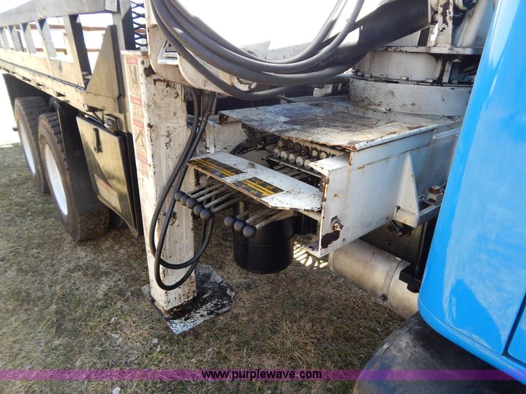 image for item I1134 1996 International 4900 flatbed truck with crane