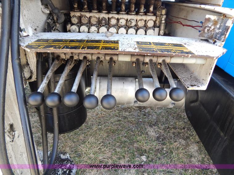 image for item I1134 1996 International 4900 flatbed truck with crane