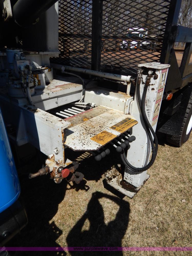 image for item I1134 1996 International 4900 flatbed truck with crane