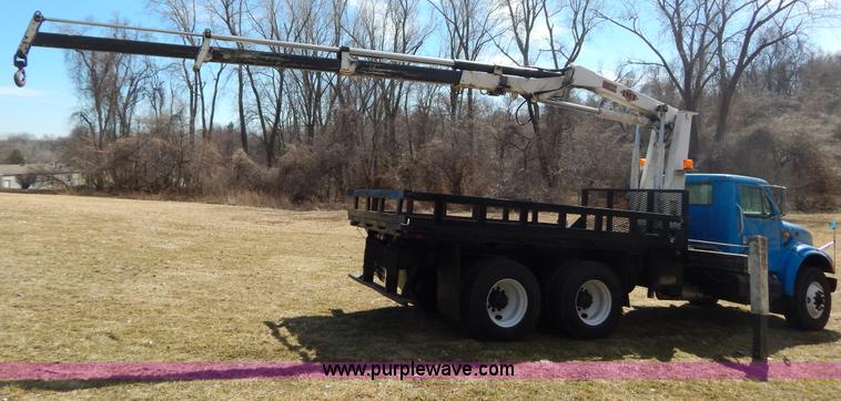 image for item I1134 1996 International 4900 flatbed truck with crane