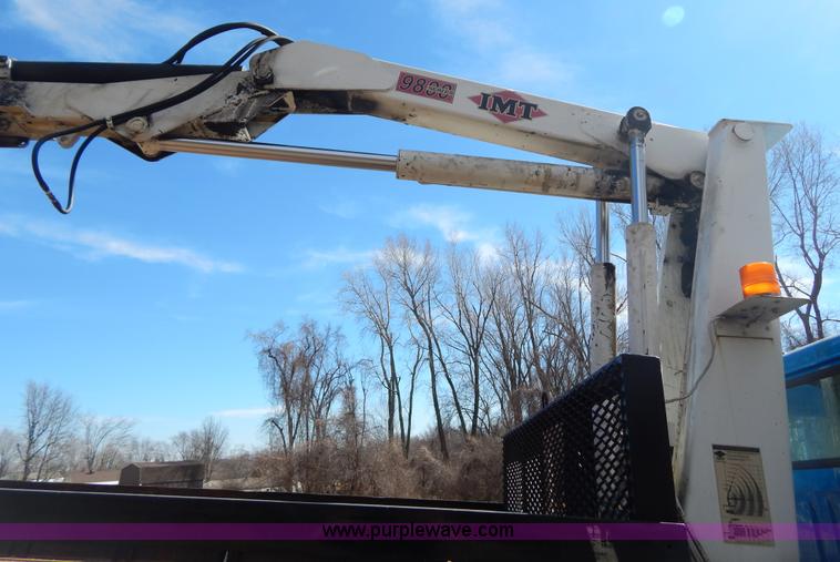 image for item I1134 1996 International 4900 flatbed truck with crane